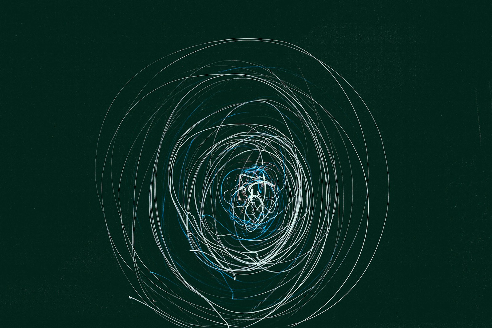 Long-exposure circles of light on a dark ground